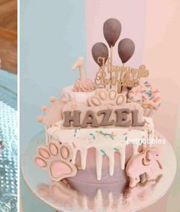 Hazel's pink paw-print celebration cake